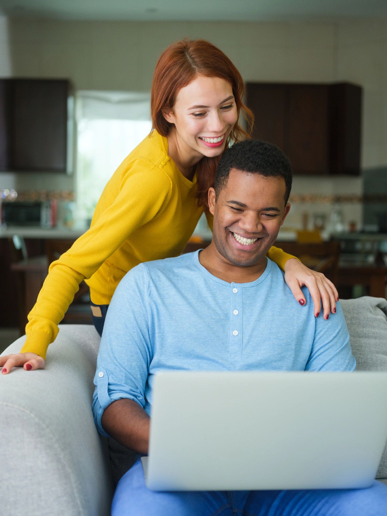Couple taking part in a video consultation from home